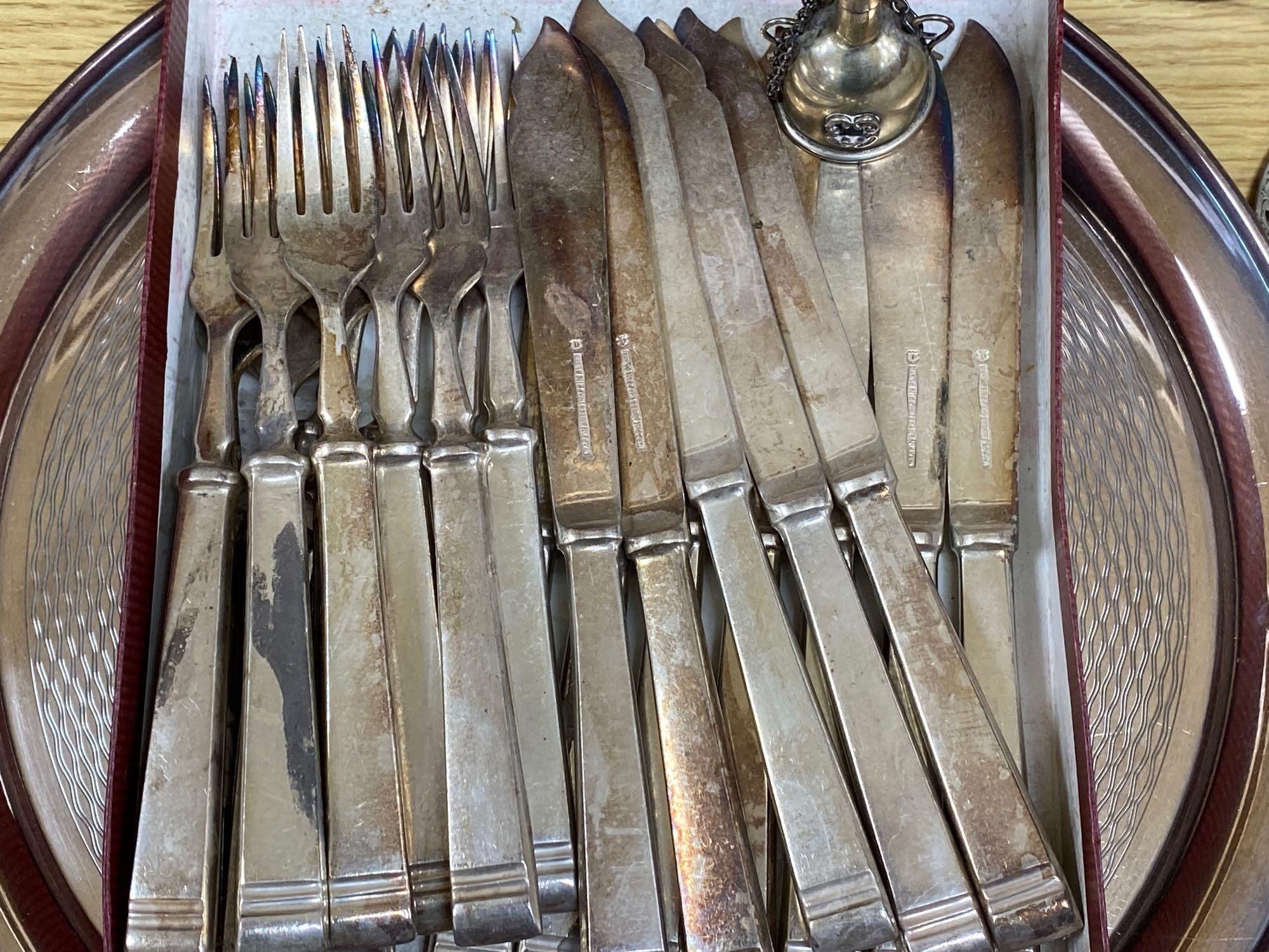 A quantity of plated items including coasters, flatware, cream jug, etc.